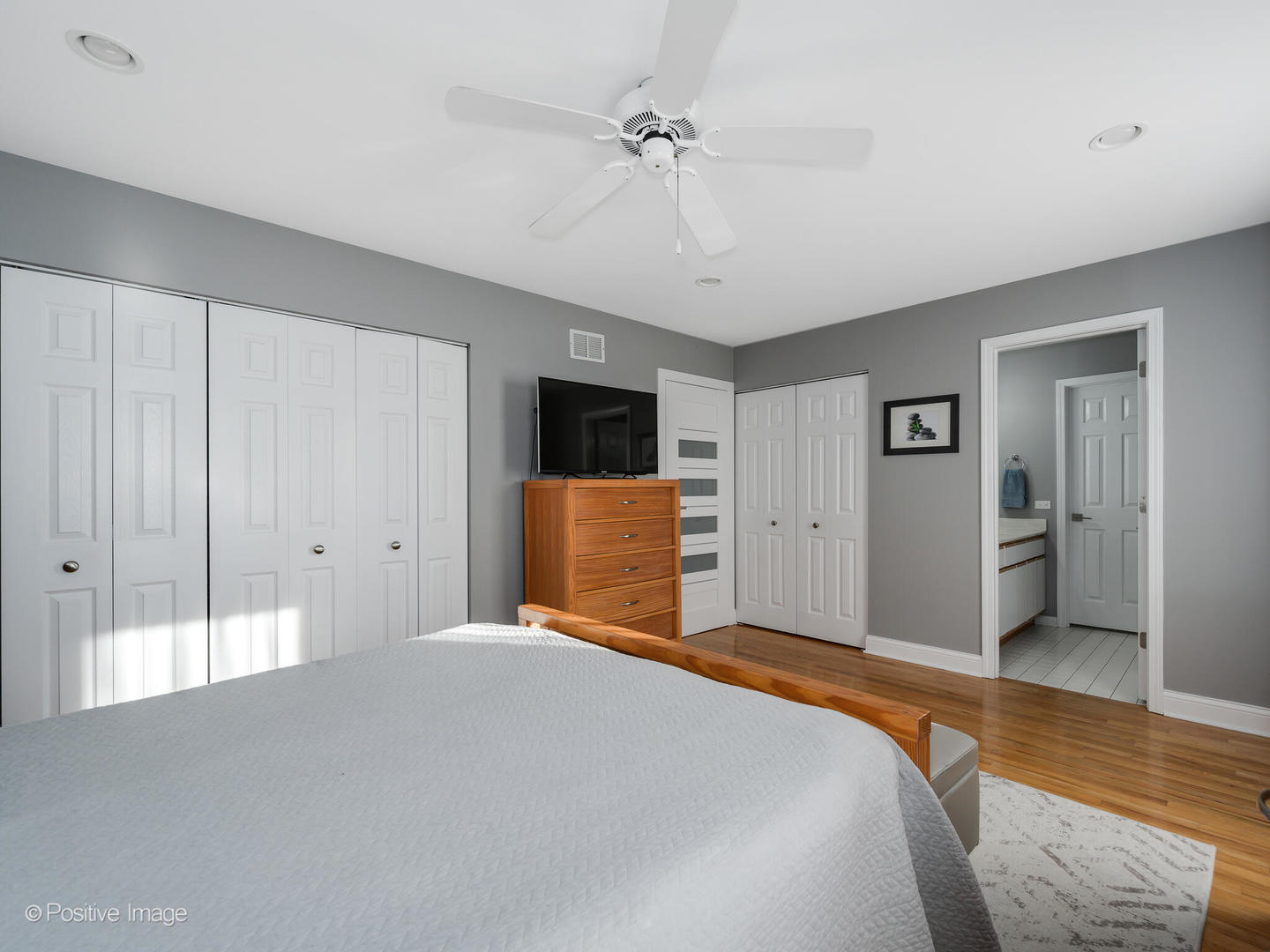 2008 Clematis Drive Algonquin, IL 60102 - Photo 10 of 25 a bedroom with a large bed and a chandelier