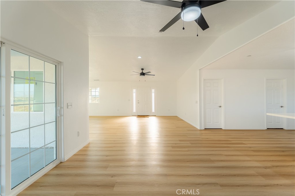 16925 Nanticoke Road Apple Valley, CA 92307 - Photo 44 of 87 a view of empty room with wooden floor and fan