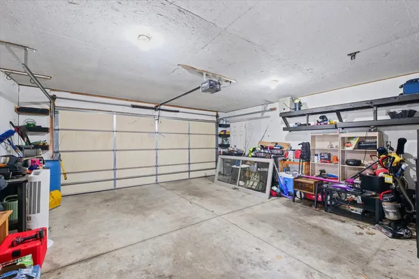 a view of a garage with rack and bicycle