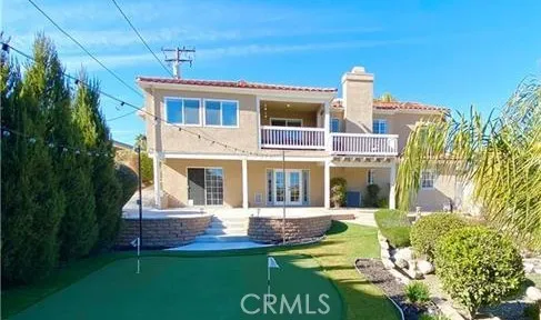 a front view of a house with a yard table and chairs