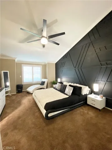 a spacious bedroom with a bed and window