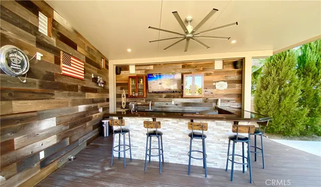 a dining area with a table and chairs
