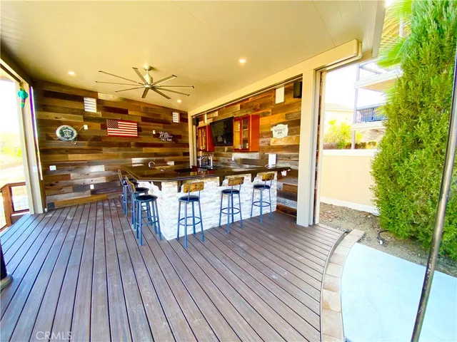 a open kitchen with stainless steel appliances granite countertop a stove and a wooden floors