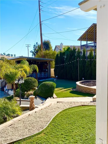 a view of a swimming pool and patio
