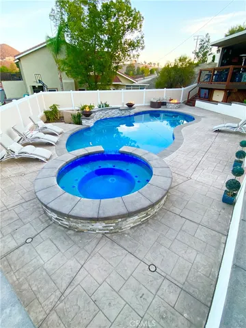 a view of a swimming pool with a patio