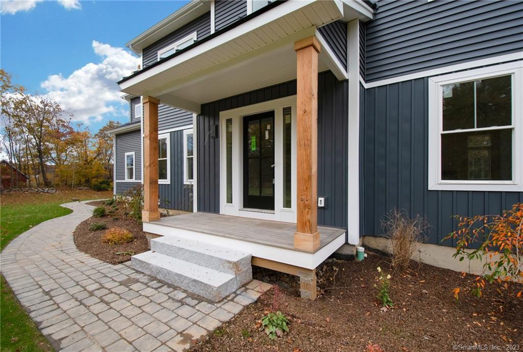 30 Meadow Brook Road Newtown, CT 06470 - Photo 1 of 1 a front view of a house with garden