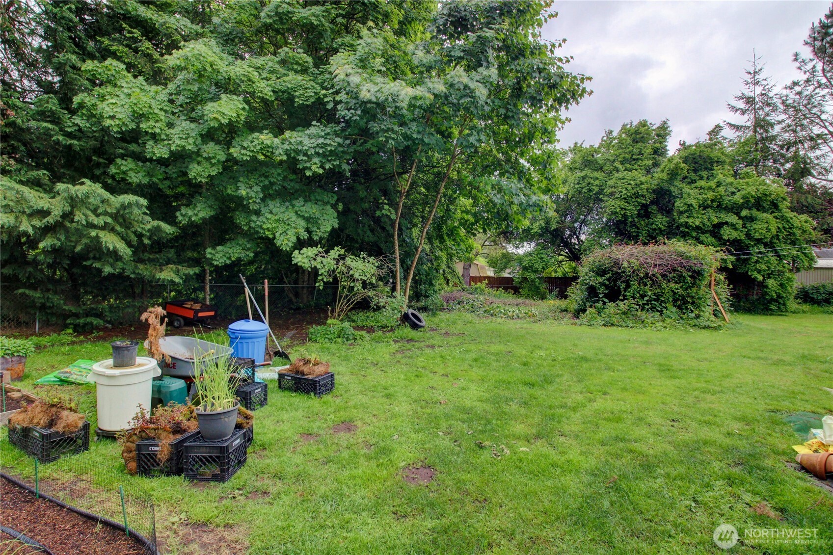 7185 Old Highway 99 North Road Burlington, WA 98233 - Photo 10 of 26 a backyard of a house with table and chairs