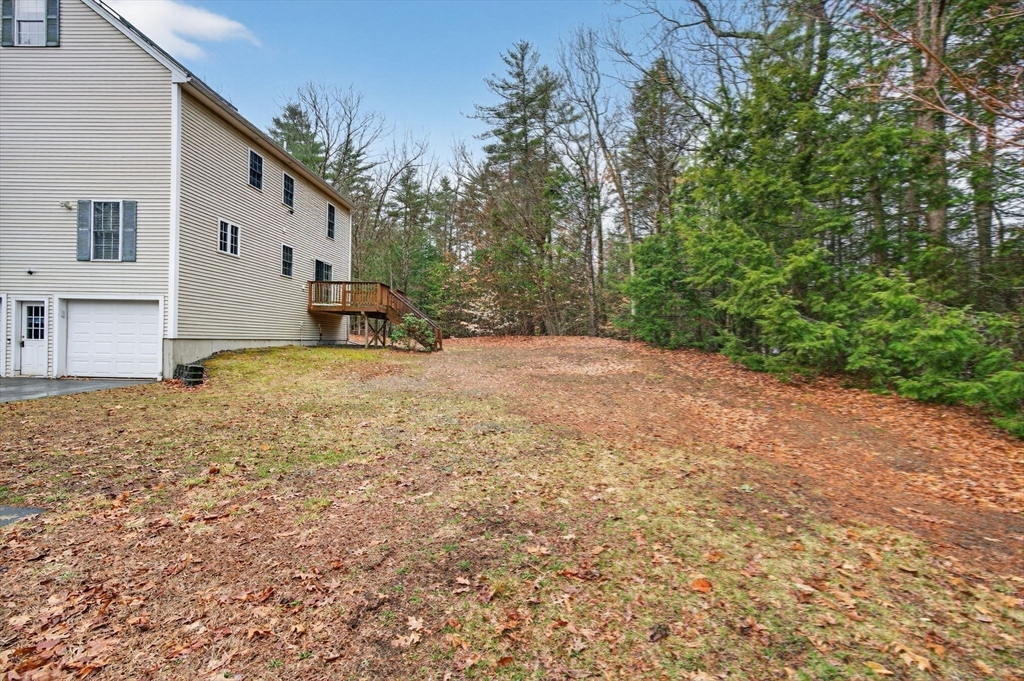 15 Scribner Road Fremont, NH 03044 - Photo 19 of 42 a view of a house with a yard