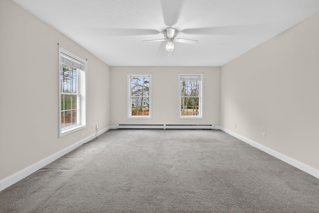15 Scribner Road Fremont, NH 03044 - Photo 25 of 42 an empty room with windows and fan