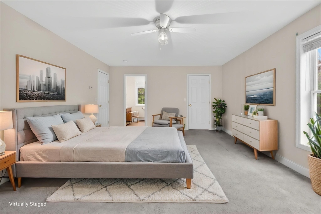 15 Scribner Road Fremont, NH 03044 - Photo 27 of 42 a spacious bedroom with a bed and a couch
