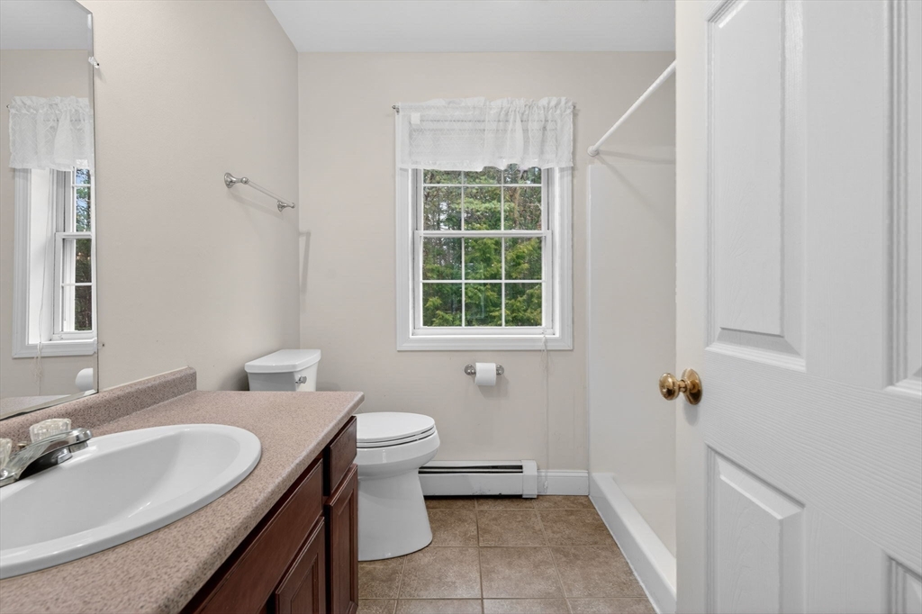 15 Scribner Road Fremont, NH 03044 - Photo 28 of 42 a bathroom with a sink and a toilet