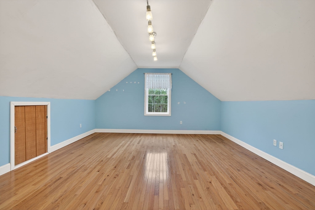 15 Scribner Road Fremont, NH 03044 - Photo 29 of 42 a view of empty room with wooden floor and fan