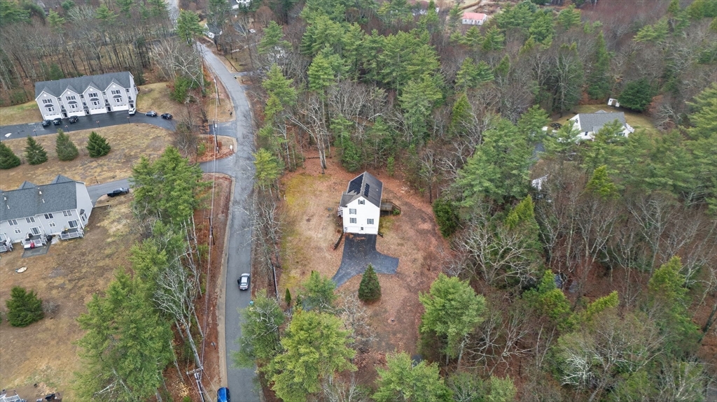 15 Scribner Road Fremont, NH 03044 - Photo 38 of 42 an aerial view of a house with outdoor space and street view