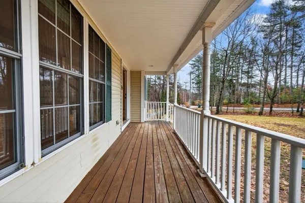 a view of balcony with wooden floor