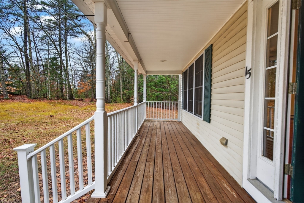 15 Scribner Road Fremont, NH 03044 - Photo 5 of 42 a view of a balcony with wooden floor and fence