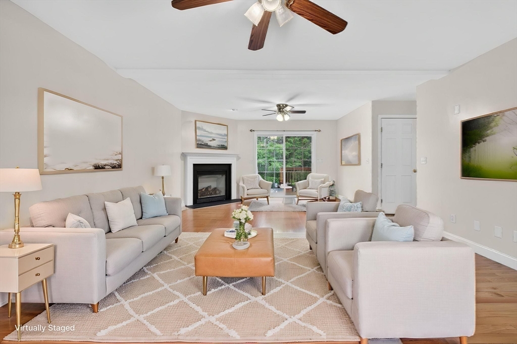 15 Scribner Road Fremont, NH 03044 - Photo 7 of 42 a living room with furniture fireplace and a flat screen tv