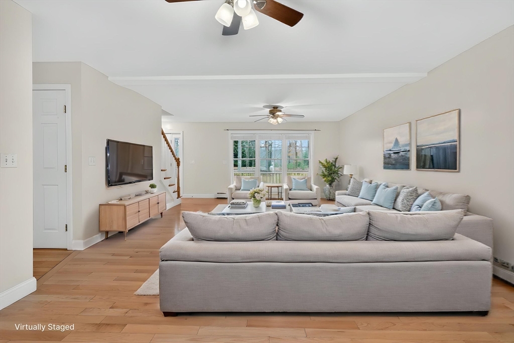 15 Scribner Road Fremont, NH 03044 - Photo 9 of 42 a living room with furniture and a flat screen tv