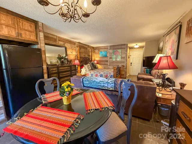 a bedroom with a bed a couch and dresser