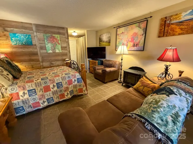 a bathroom with a shower and a sink