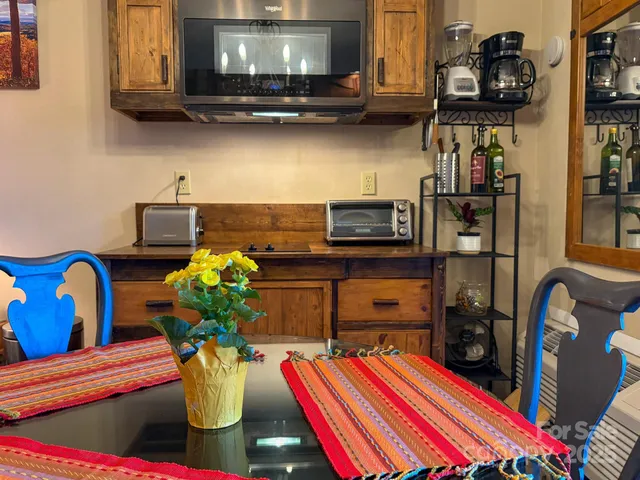 a bedroom with a bed and a television