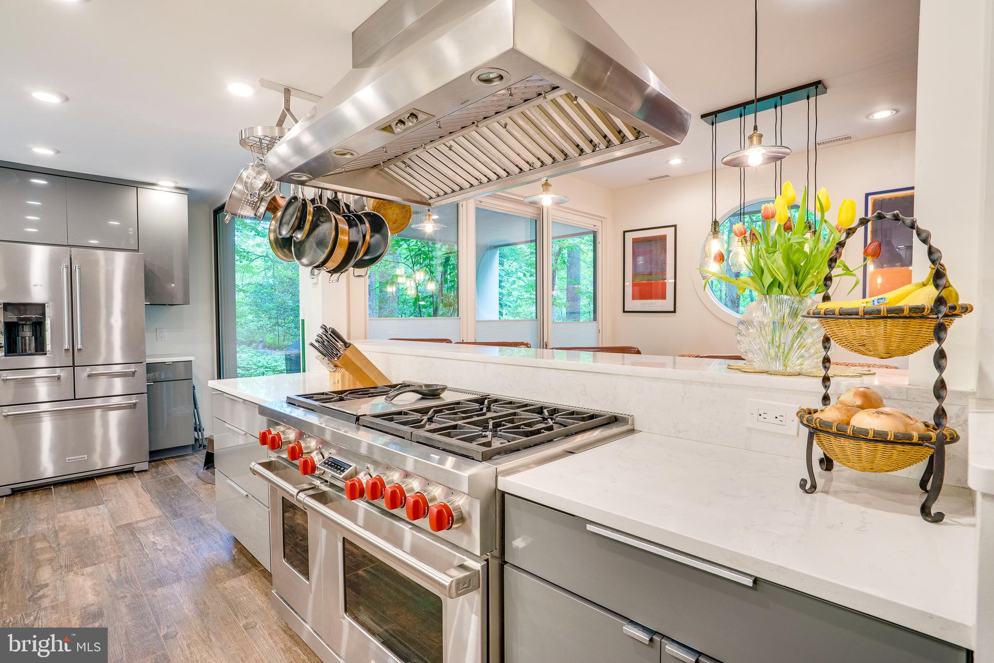 11405 Purple Beech Drive Reston, VA 20191 - Photo 18 of 72 a kitchen with stainless steel appliances granite countertop a sink a counter space and a window