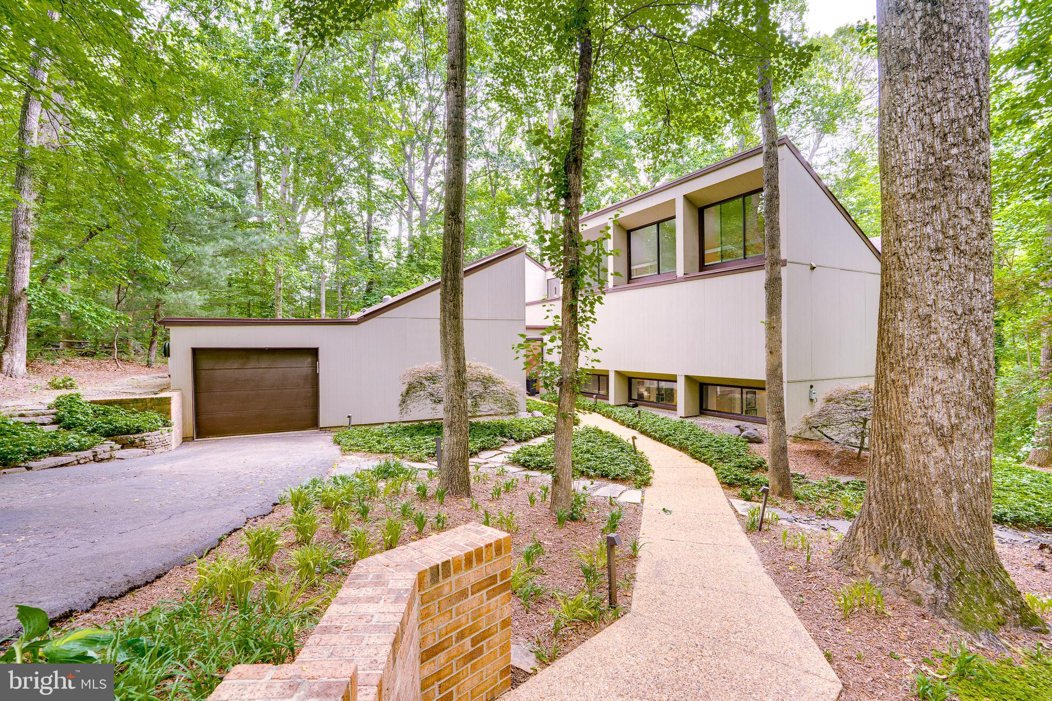 11405 Purple Beech Drive Reston, VA 20191 - Photo 2 of 72 a front view of a house with a yard and shrubs