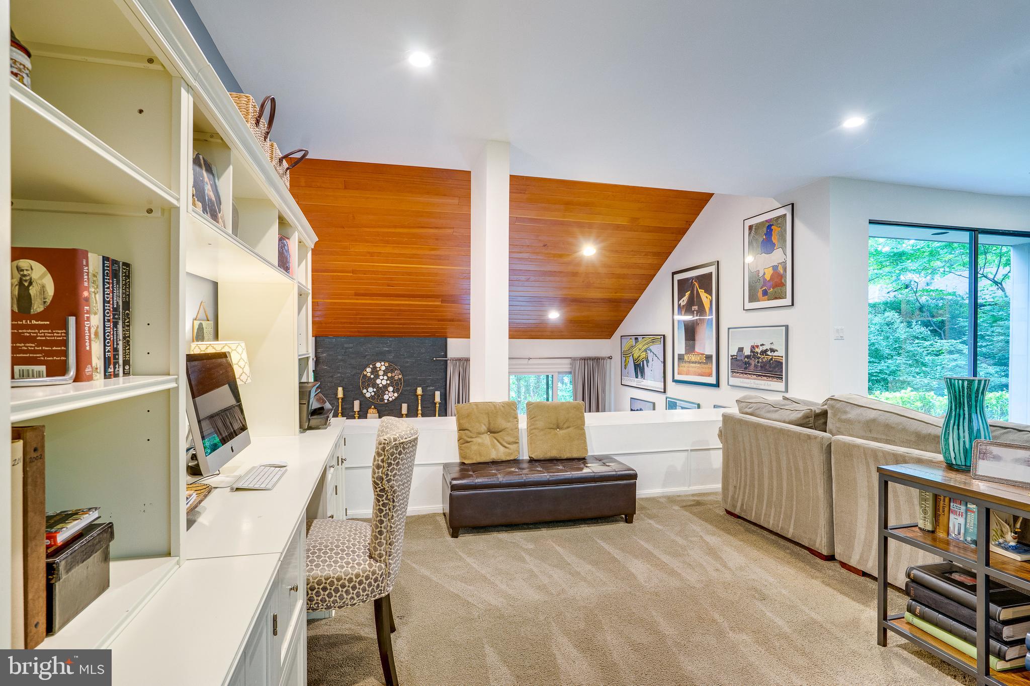 11405 Purple Beech Drive Reston, VA 20191 - Photo 32 of 72 a living room with furniture and a large window