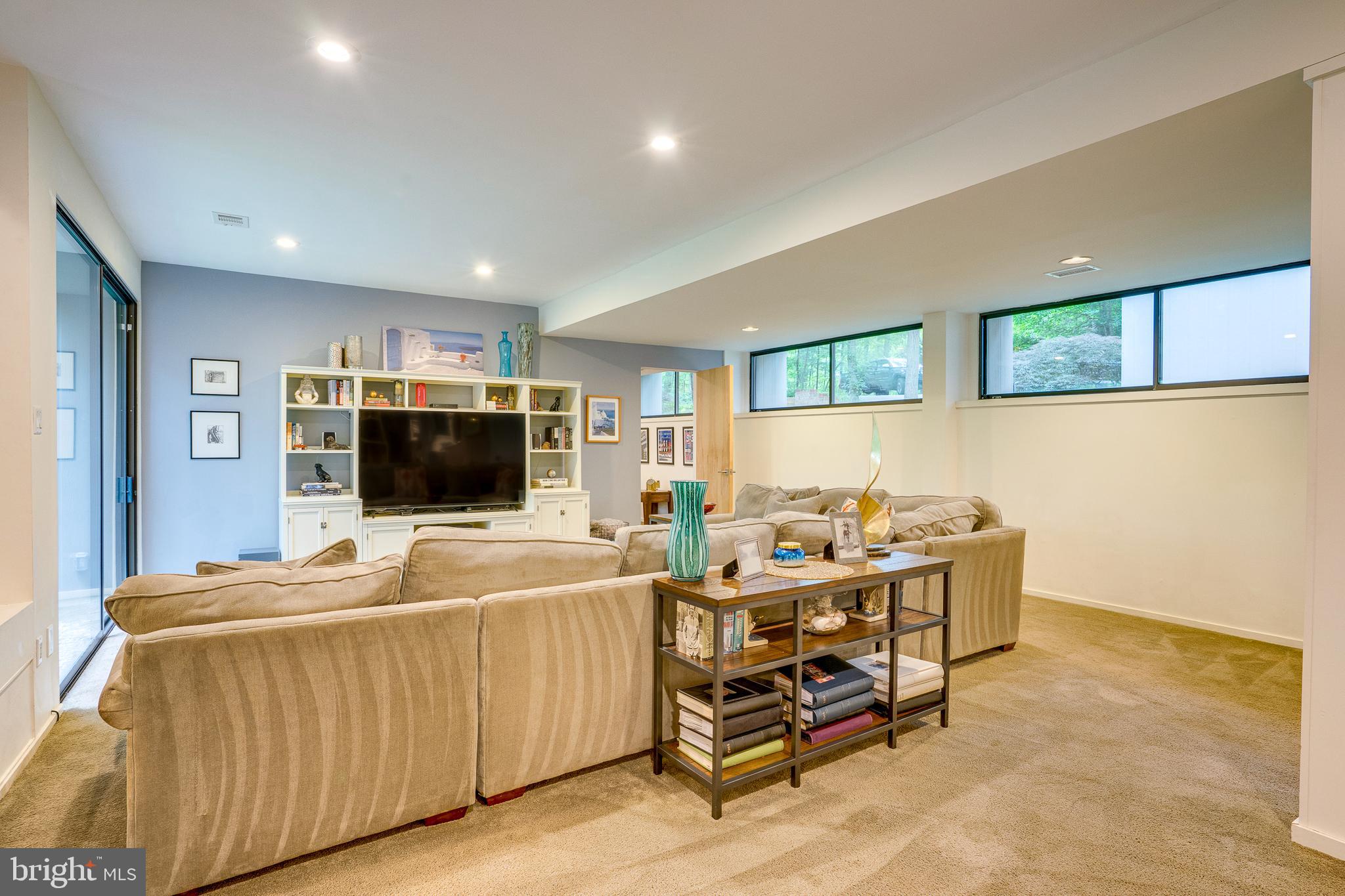 11405 Purple Beech Drive Reston, VA 20191 - Photo 35 of 72 a living room with furniture and a flat screen tv