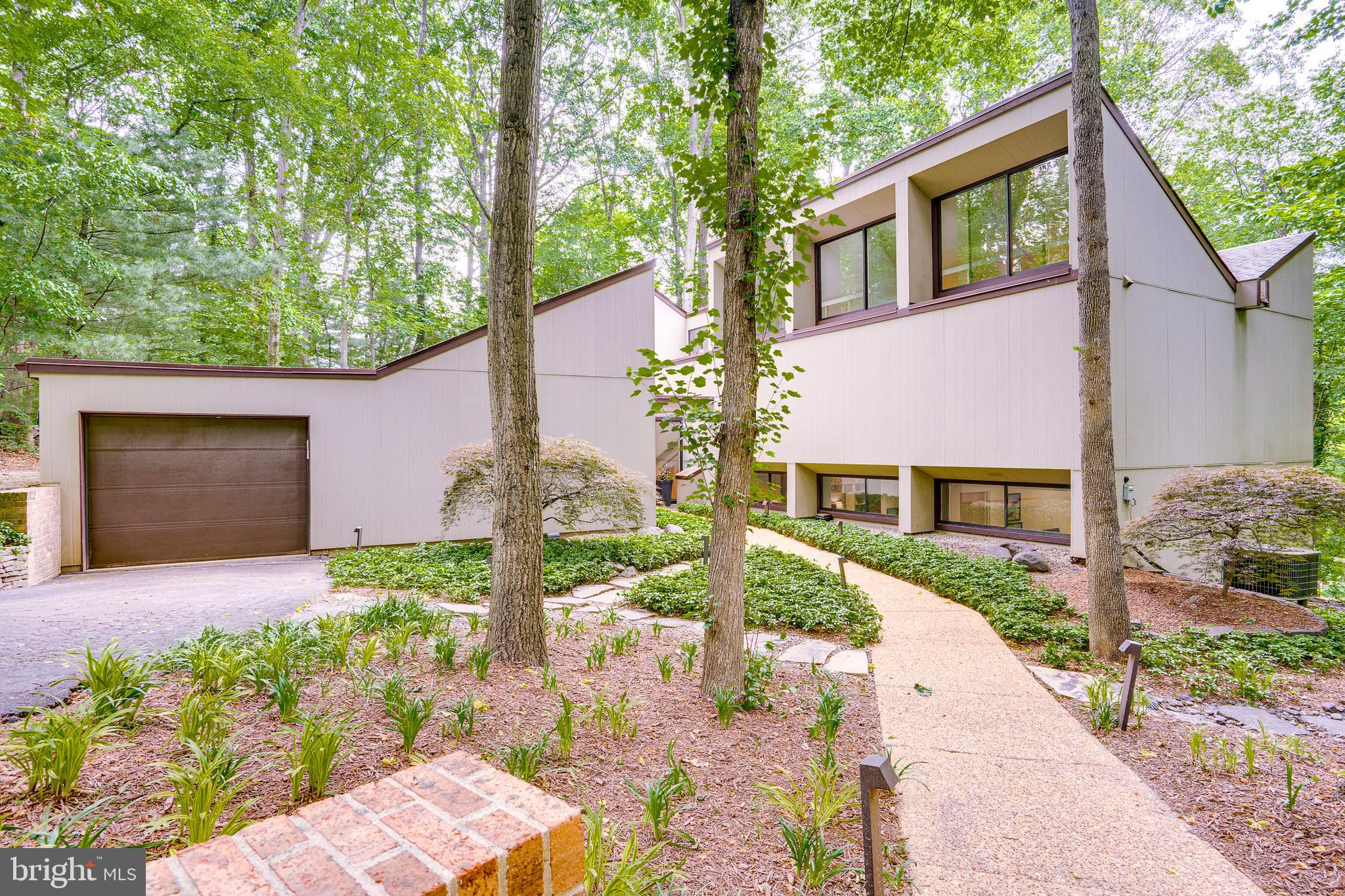 11405 Purple Beech Drive Reston, VA 20191 - Photo 4 of 72 a front view of a house with garden