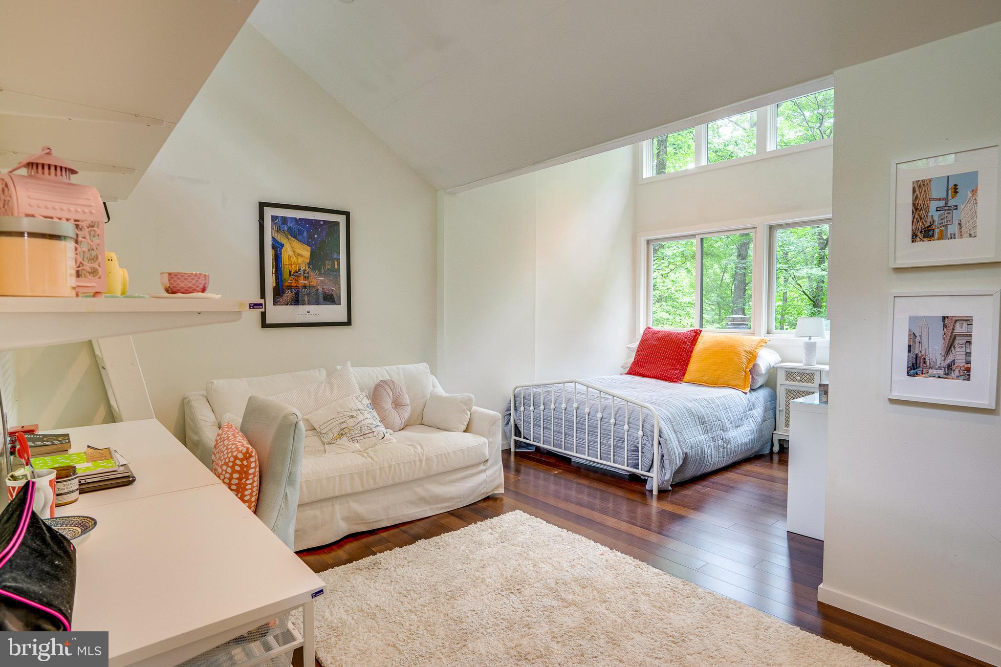 11405 Purple Beech Drive Reston, VA 20191 - Photo 47 of 72 a living room with a bed furniture and a large window