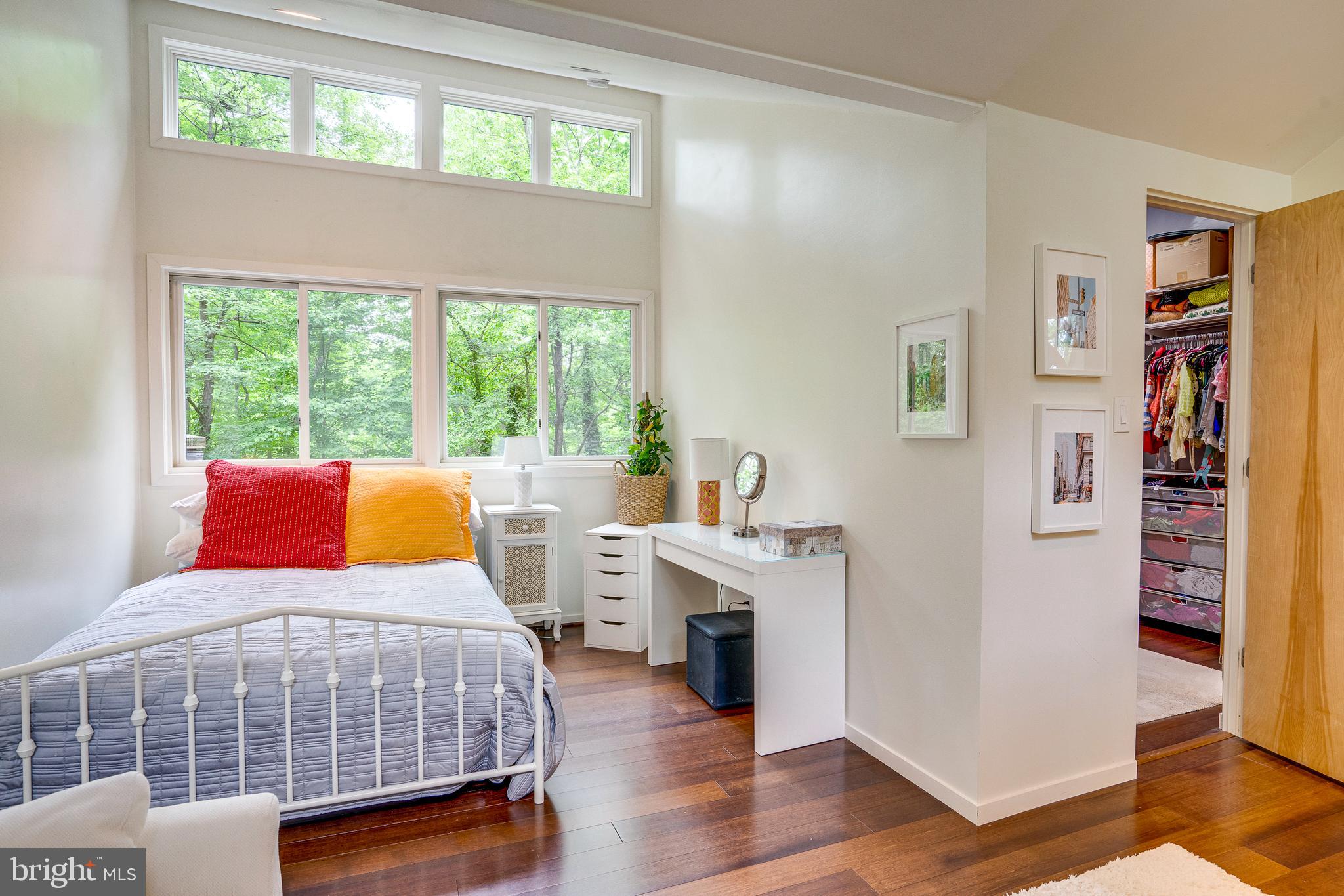 11405 Purple Beech Drive Reston, VA 20191 - Photo 49 of 72 a bedroom with a bed and a table in it