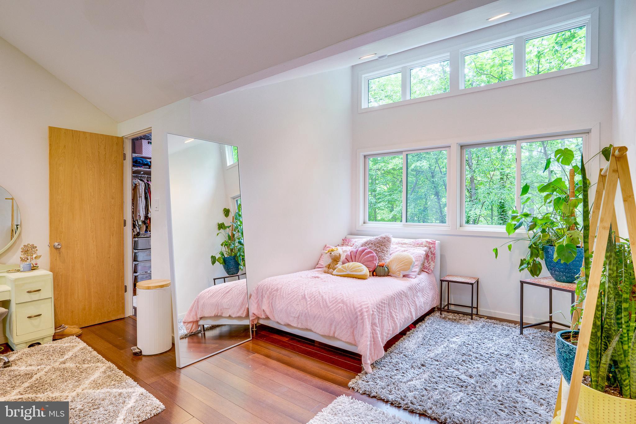 11405 Purple Beech Drive Reston, VA 20191 - Photo 52 of 72 a bedroom with a bed and a window