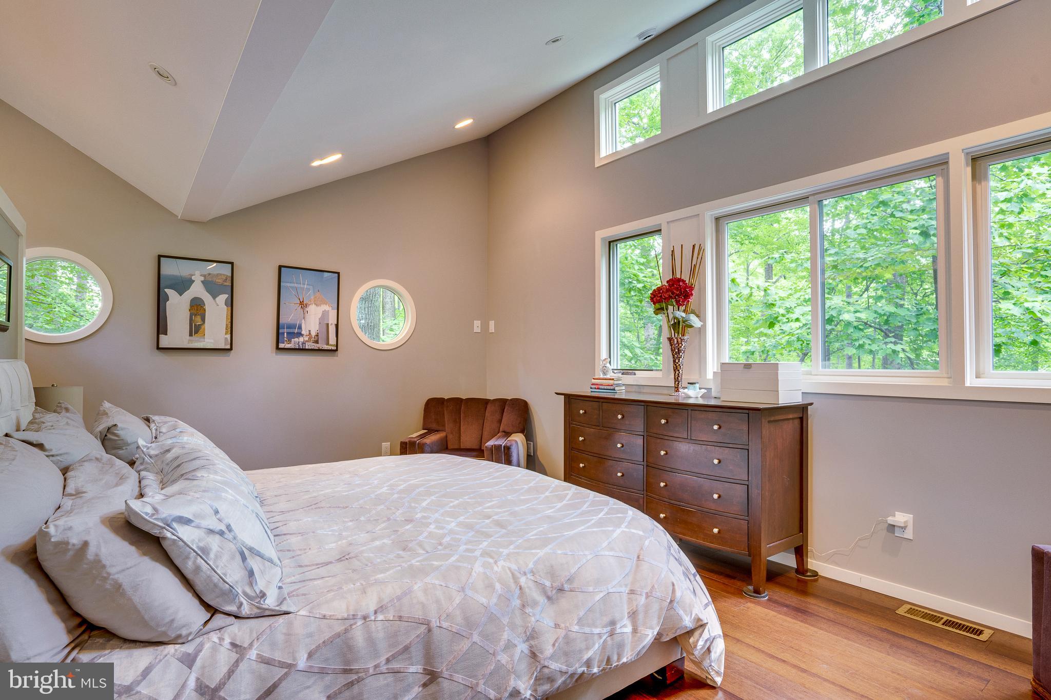 11405 Purple Beech Drive Reston, VA 20191 - Photo 56 of 72 a bedroom with a large bed and a window