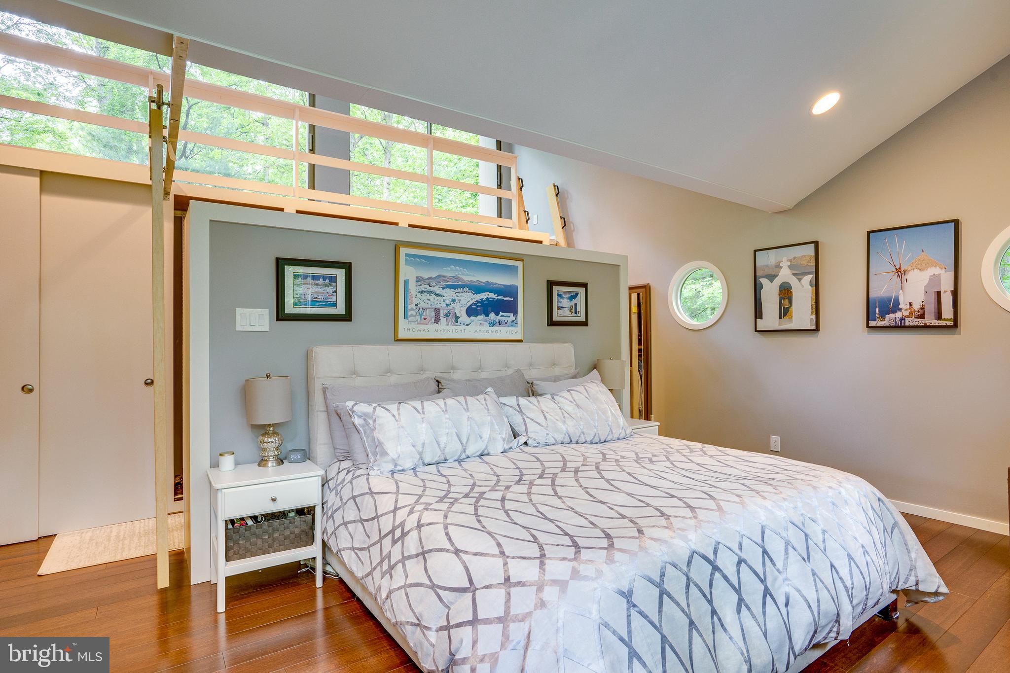 11405 Purple Beech Drive Reston, VA 20191 - Photo 57 of 72 a bedroom with a large bed and a window