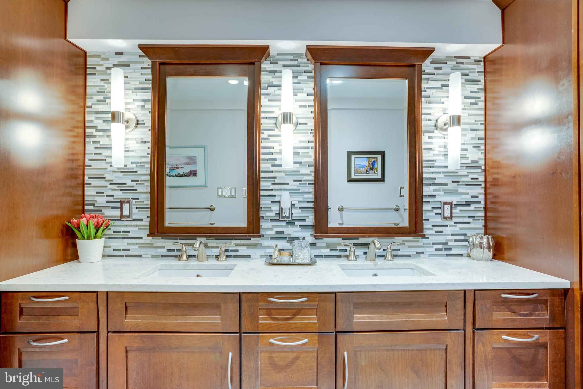 11405 Purple Beech Drive Reston, VA 20191 - Photo 62 of 72 a bathroom with a sink and a mirror