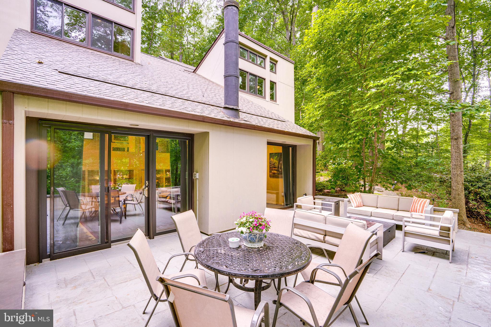 11405 Purple Beech Drive Reston, VA 20191 - Photo 65 of 72 a view of a patio with a table and chairs