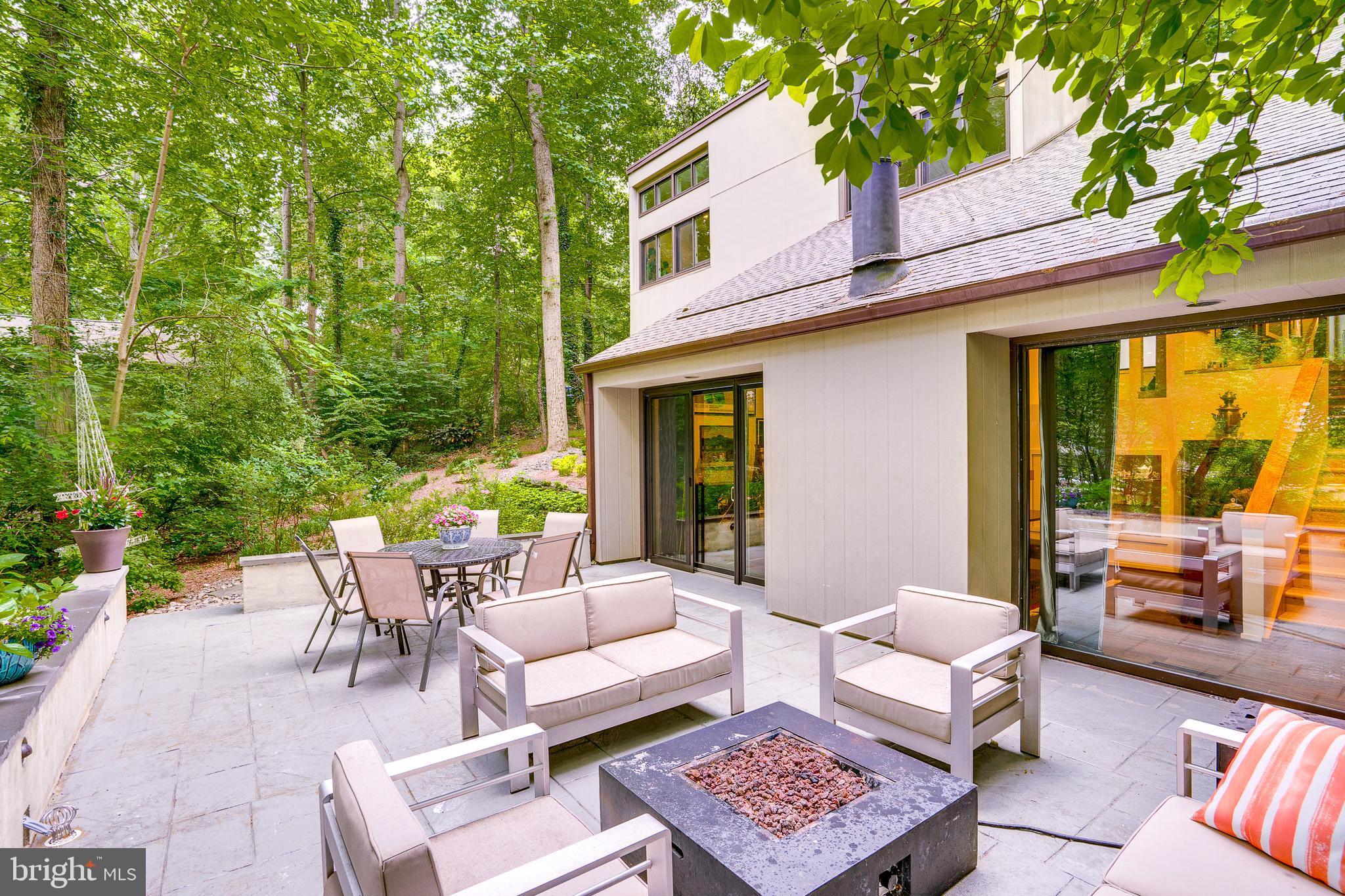 11405 Purple Beech Drive Reston, VA 20191 - Photo 66 of 72 a view of a patio with couches table and chairs and potted plants