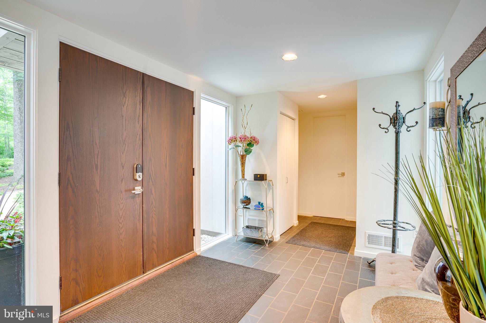 11405 Purple Beech Drive Reston, VA 20191 - Photo 7 of 72 a living room with a couch and a large window