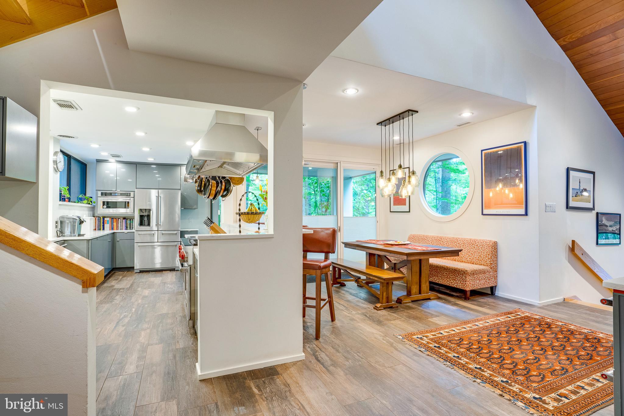 11405 Purple Beech Drive Reston, VA 20191 - Photo 9 of 72 a living room with furniture and a dining table with wooden floor