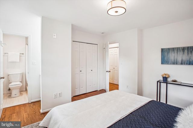 a bedroom with a bed and a view of bathroom