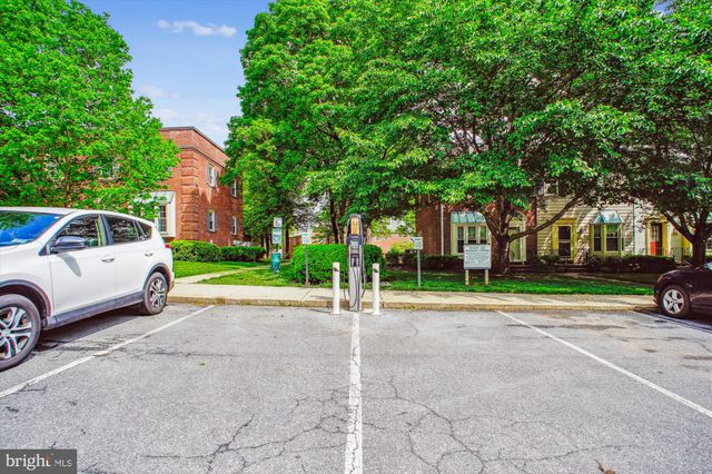 a view of a car parked in front of a house