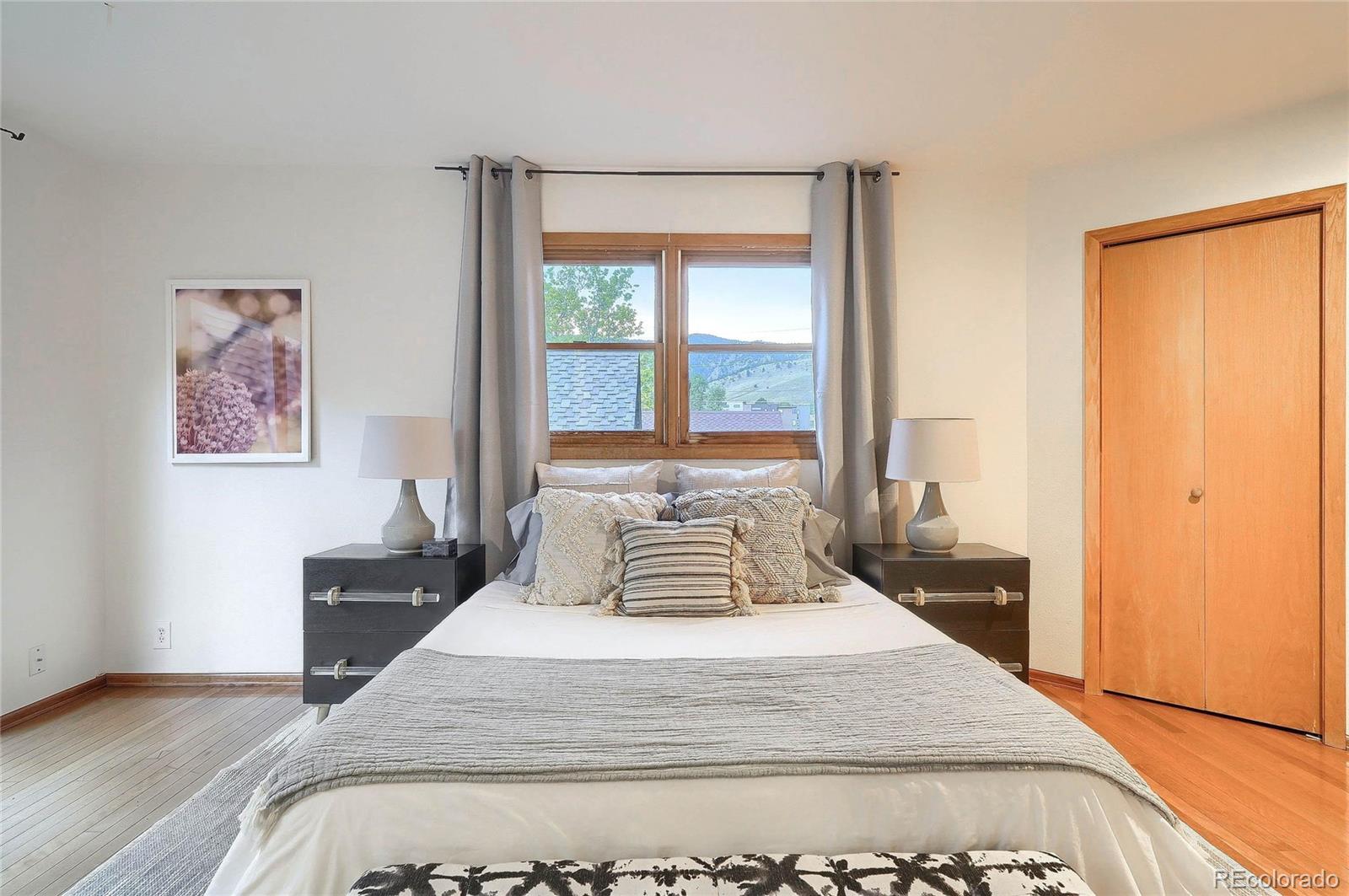 4150 Riverside Avenue Boulder, CO 80304 - Photo 12 of 35 a bedroom with a large bed and a large window