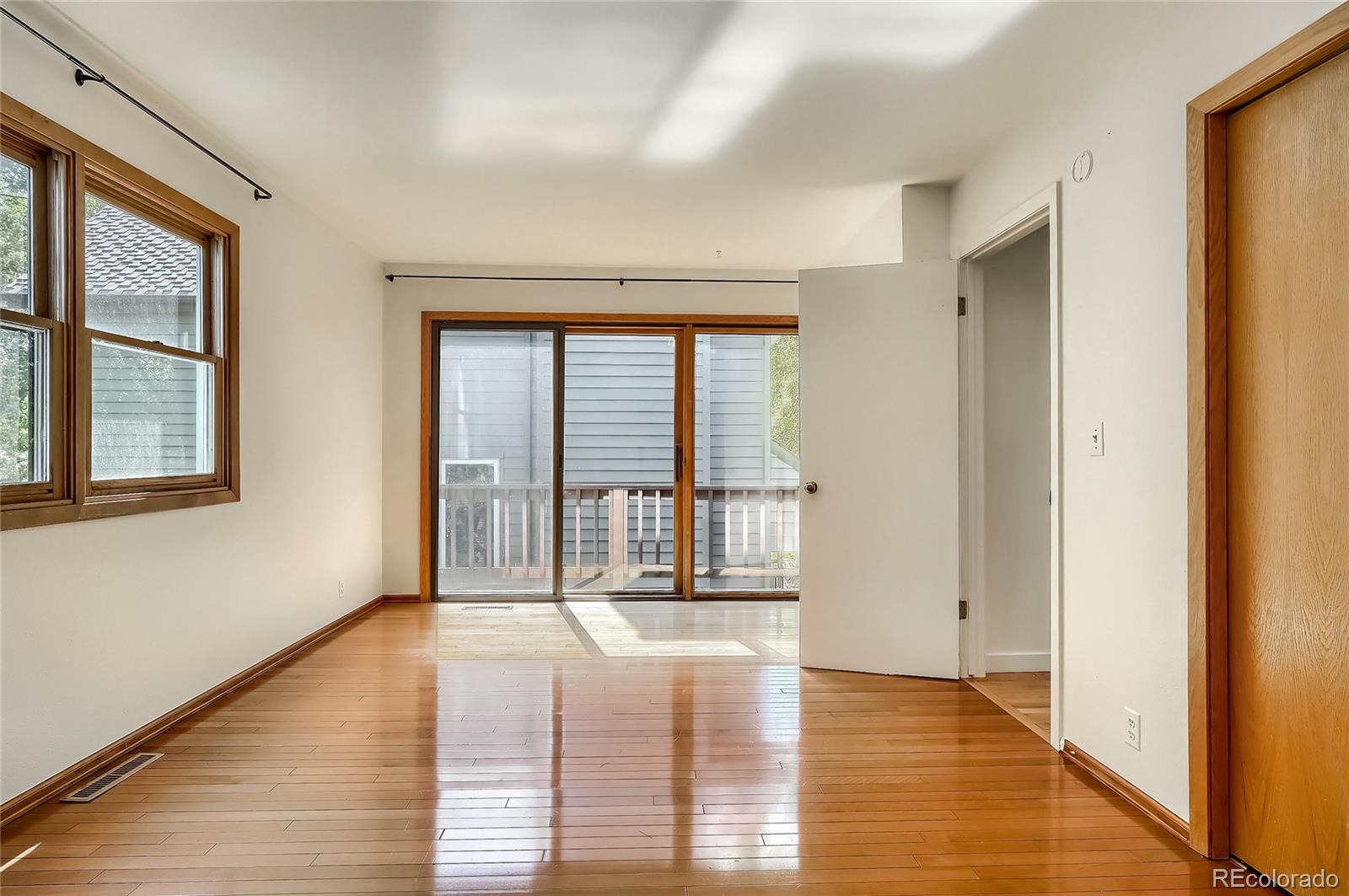 4150 Riverside Avenue Boulder, CO 80304 - Photo 14 of 35 a view of an empty room with wooden floor and a window
