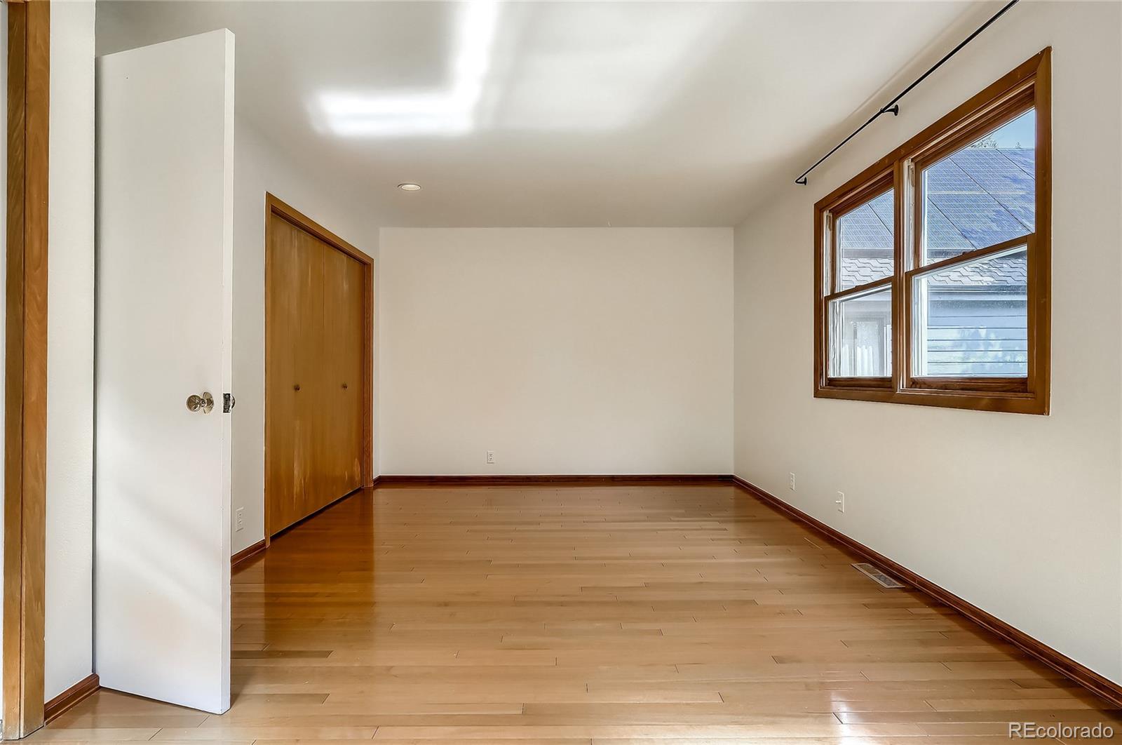 4150 Riverside Avenue Boulder, CO 80304 - Photo 15 of 35 a view of an empty room with wooden floor and a window