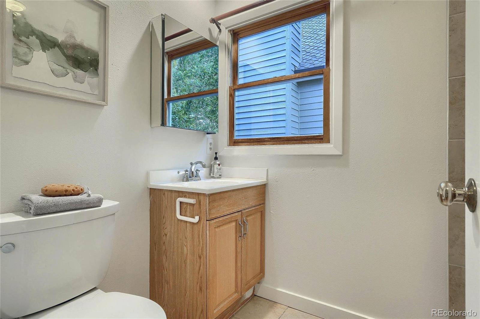 4150 Riverside Avenue Boulder, CO 80304 - Photo 18 of 35 a bathroom with a sink toilet and window