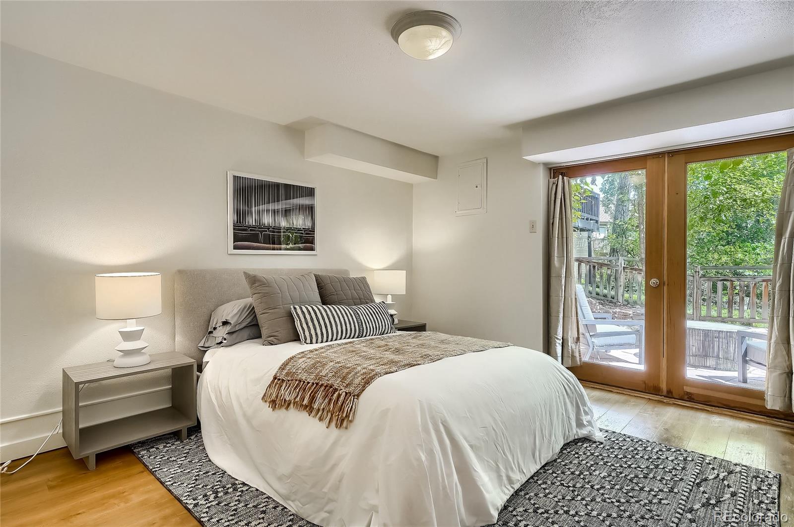 4150 Riverside Avenue Boulder, CO 80304 - Photo 19 of 35 a bedroom with a bed and glass window