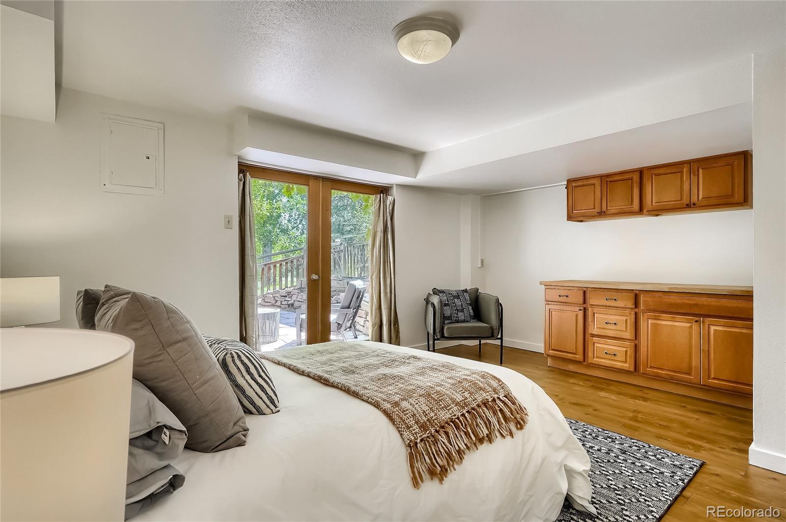 4150 Riverside Avenue Boulder, CO 80304 - Photo 20 of 35 a bedroom with a bed and wooden floor