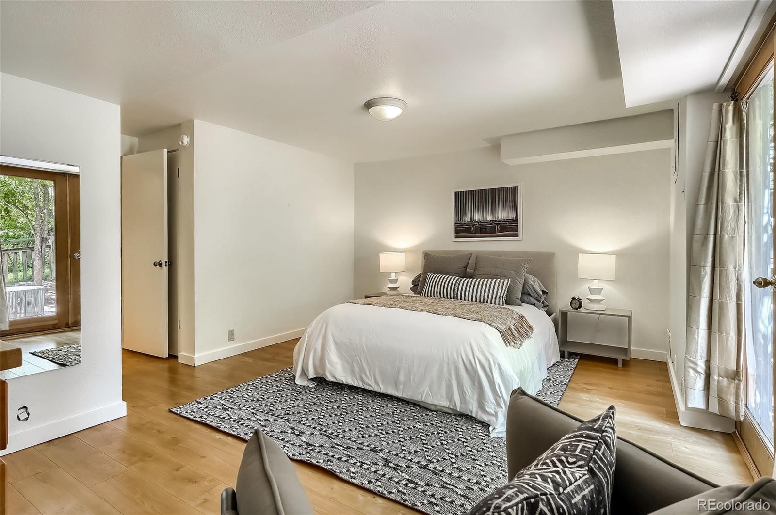 4150 Riverside Avenue Boulder, CO 80304 - Photo 21 of 35 a bedroom with a bed and wooden floor