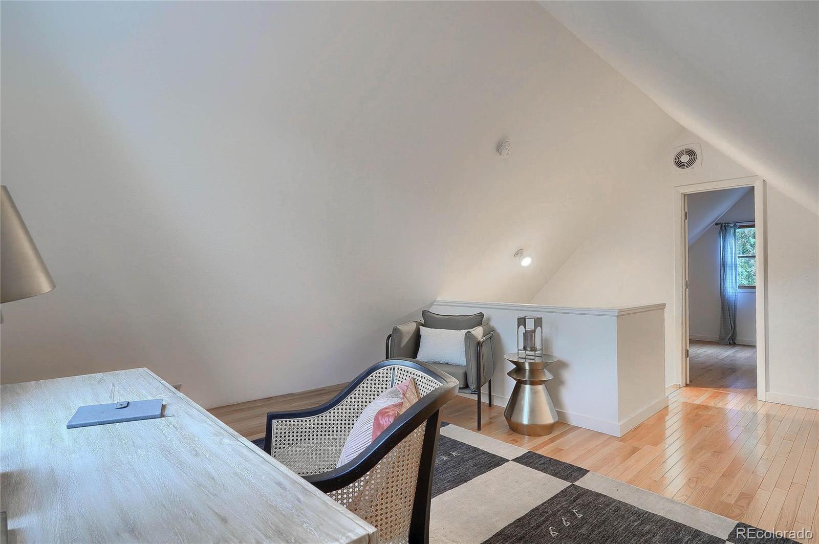 4150 Riverside Avenue Boulder, CO 80304 - Photo 27 of 35 a room with furniture and wooden floor