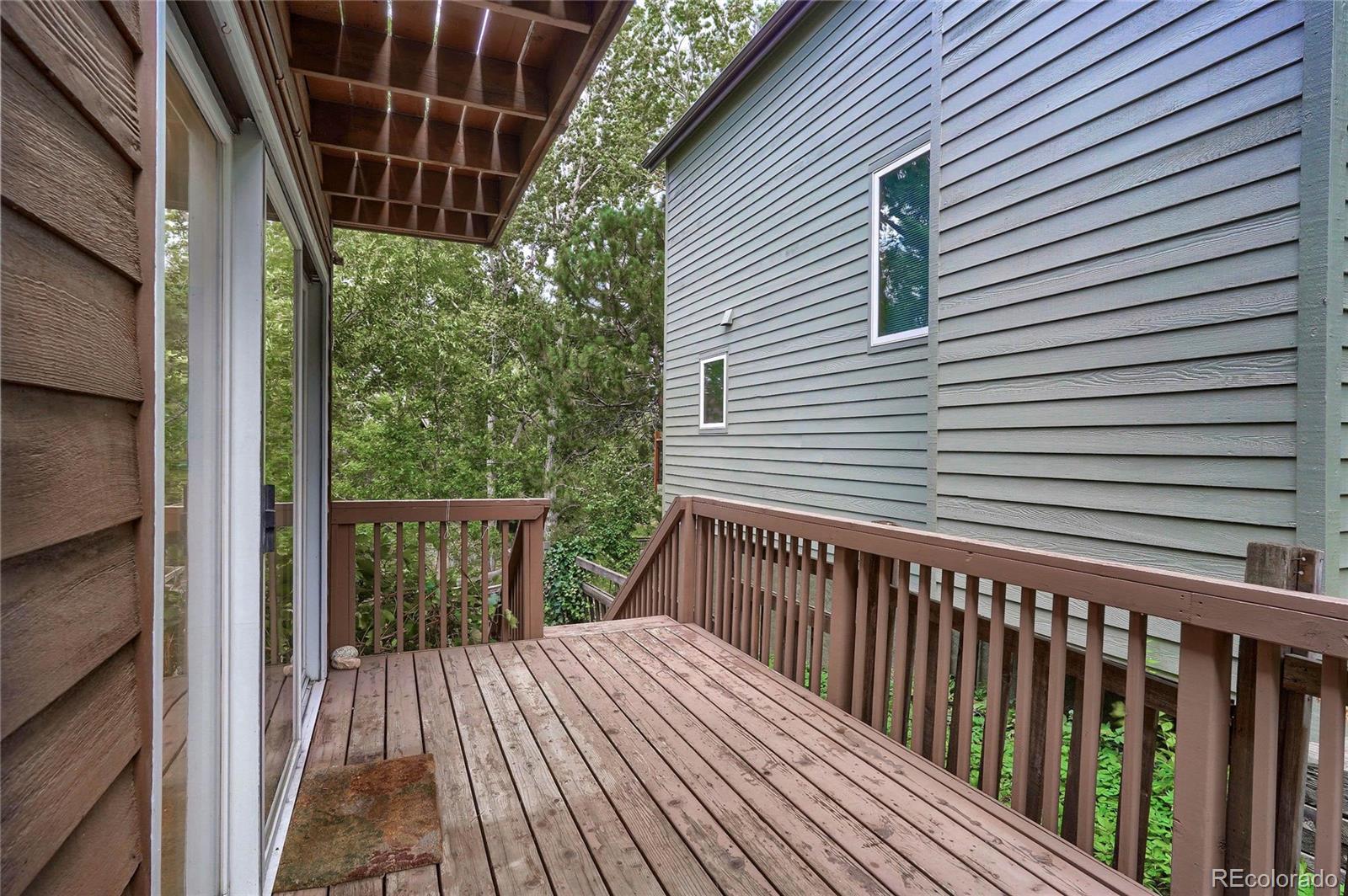 4150 Riverside Avenue Boulder, CO 80304 - Photo 29 of 35 a view of a wooden balcony and trees